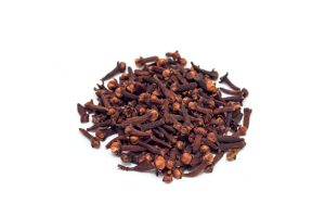 Heap of spice cloves isolated on a white background